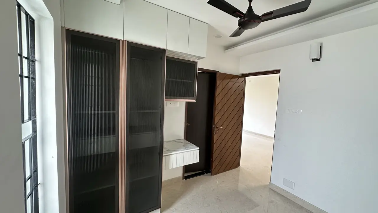 Study room with fluted-glass wardrobes and compact desk
